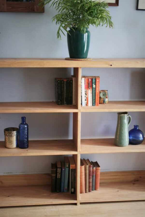 Large irregular wooden bookcase in chunky rustic natural wood, handmade in Somerset UK. Middle view.
