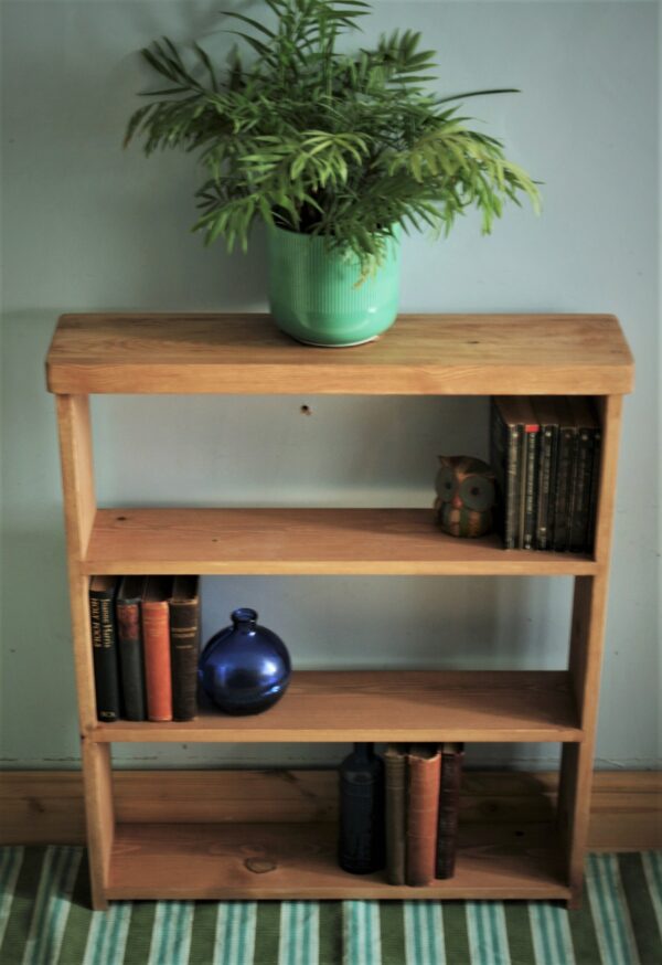 Slim wooden bookshelves and shallow bookcase in natural wood. Custom made in Somerset UK.