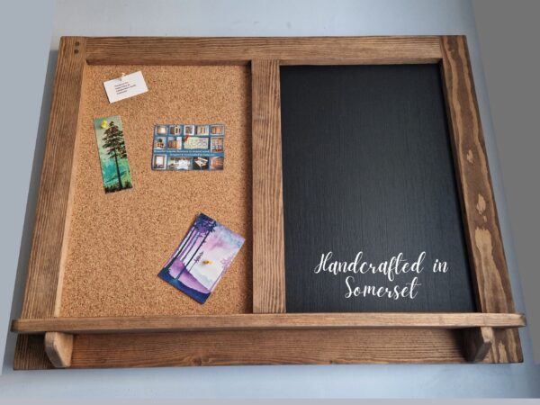 Wooden chalk cork board with rustic shelf; low view.
