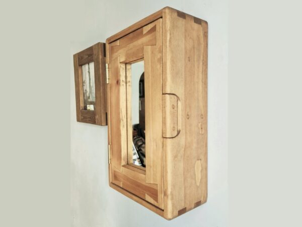 Slim bathroom mirror cabinet in natural rustic wood. Side view.
