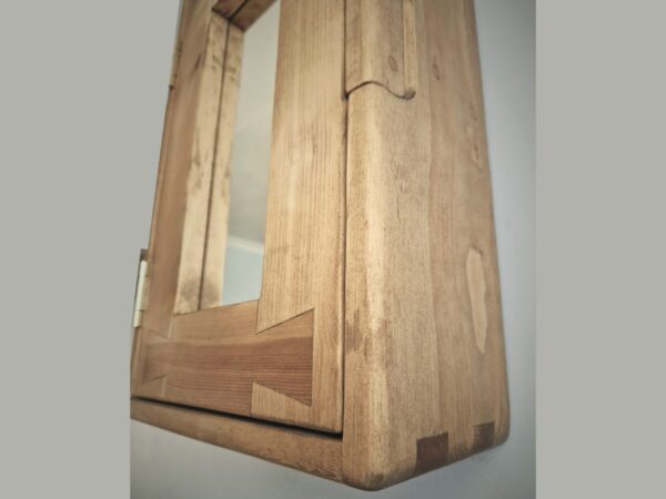 Slim bathroom mirror cabinet in natural rustic wood. Handmade in UK, view of finger joints.