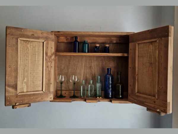Farmhouse kitchen cabinet in natural wood, modern rustic style handmade in Somerset UK. With vintage glassware on display.