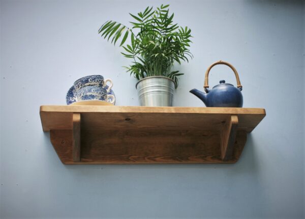 Small wooden kitchen shelf in chunky natural wood. For cookery books and plants, 62 cm low view. Handmade in Somerset UK