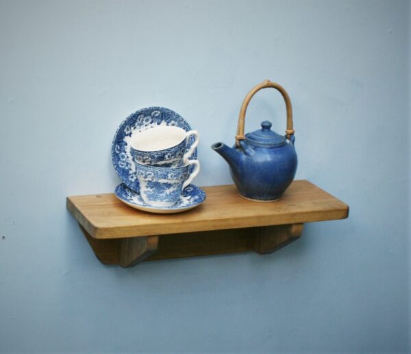 Small wooden kitchen shelf in chunky natural wood. For cookery books, plants and mugs, handmade in Somerset UK