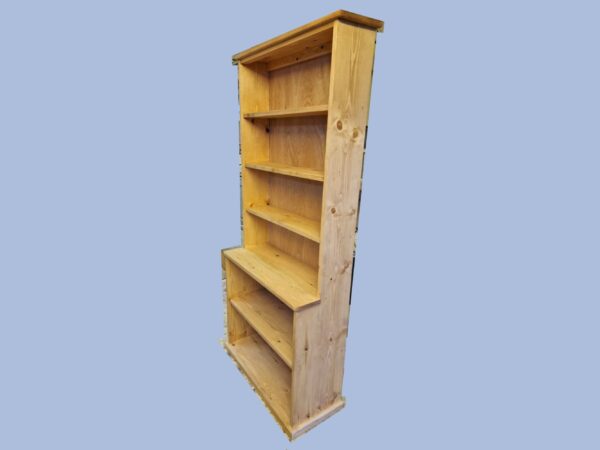 Tall step-back bookcase and large wooden bookshelf with a deep base is handmade in Somerset UK from natural rustic wood. Right side view.