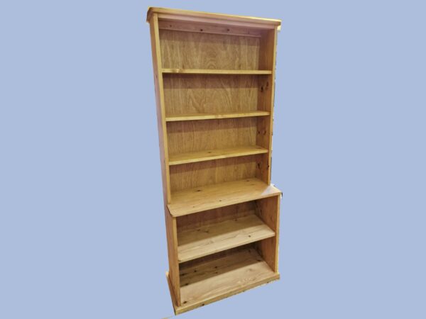 Tall step-back bookcase and large wooden bookshelf with a deep base is handmade in Somerset UK from natural rustic wood. Right front view.