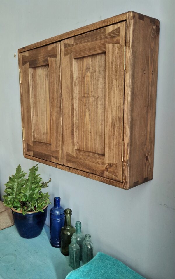Dark wood bathroom cupboard in natural wood, minimalist rustic style handmade in Somerset UK, side view.