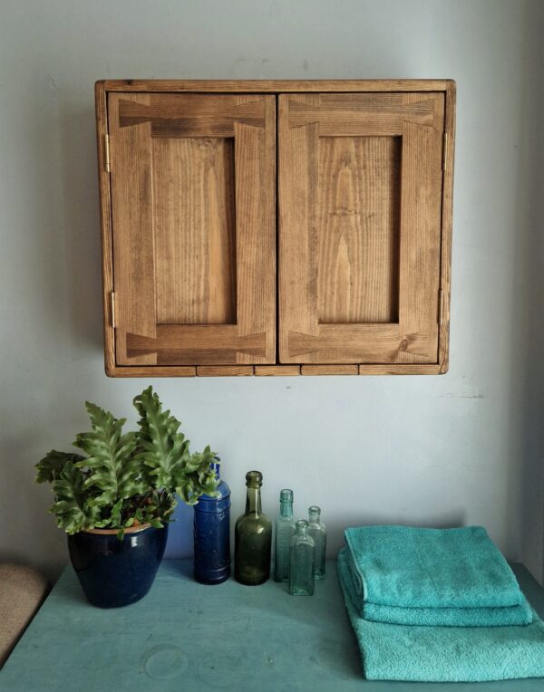 Dark wood bathroom cupboard in natural wood, minimalist rustic style handmade in Somerset UK, front view.