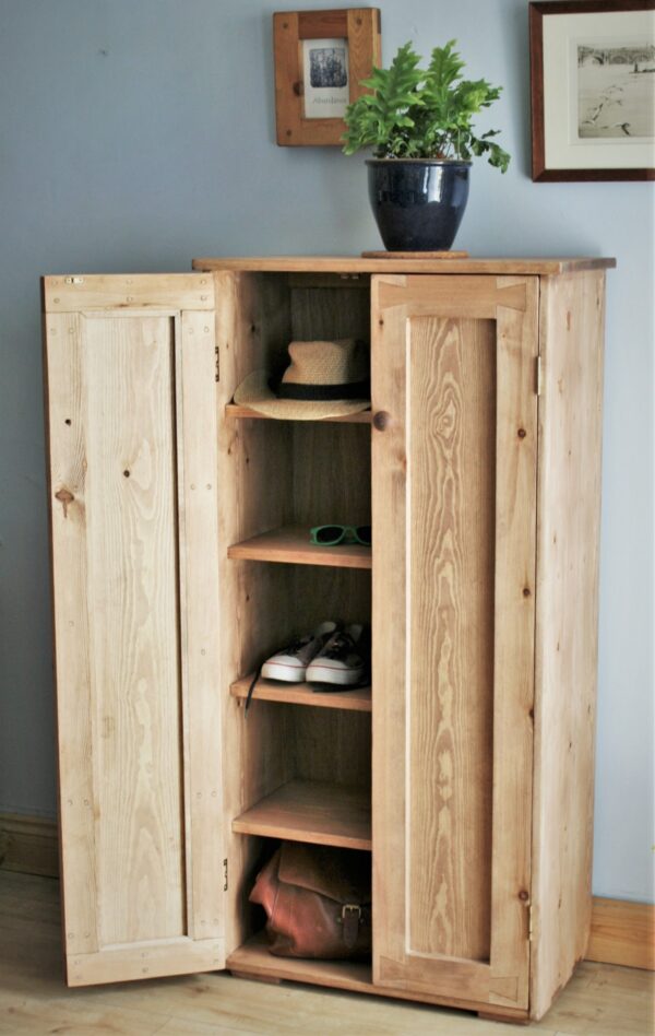 Large shoe storage cabinet and tall wooden hallway cupboard in minimalist rustic style. Designed and handmade in Somerset UK, seen with 1 door open.