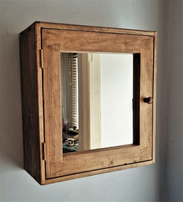 Large wooden bathroom cabinet with mirrored door and round wooden handle from rustic Somerset UK