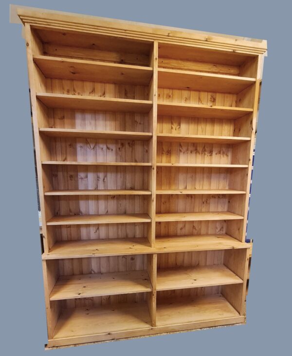 Tall step-back bookcase with solid wooden back panel and a deep base is handmade in Somerset UK from natural rustic wood.