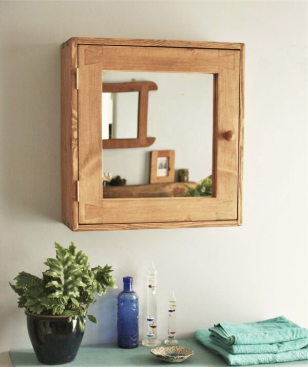 Large wooden bathroom cabinet with a mirror door and round wood handle. Handmade in Rustic Somerset UK.