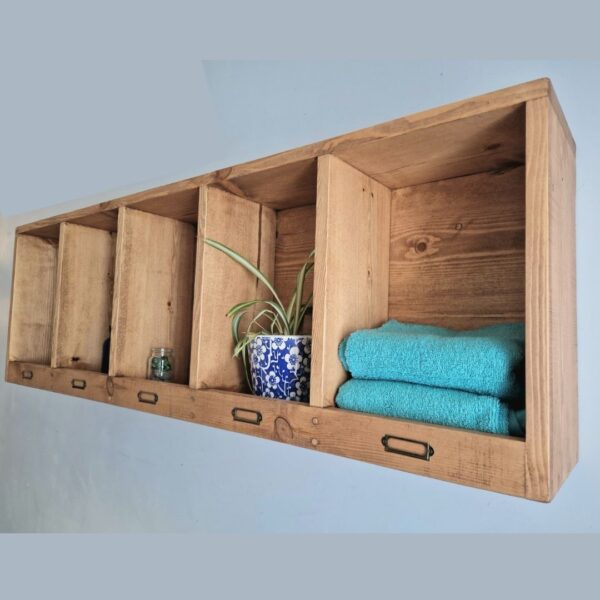 Wooden pigeon hole shelf in traditional rustic natural wood, handmade in Somerset UK, side view.